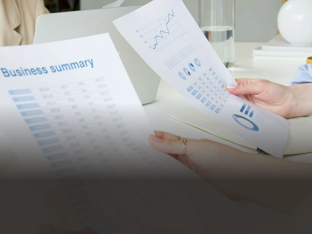 A printed health check report held in both hands
